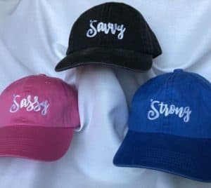 3 Soroptimist hats, sassy, savvy, strong words